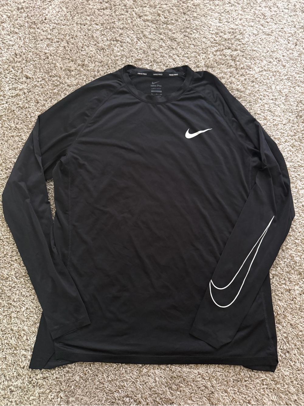 Nike Black Long-Sleeve Dri-FIT Athletic Top with White Swoosh